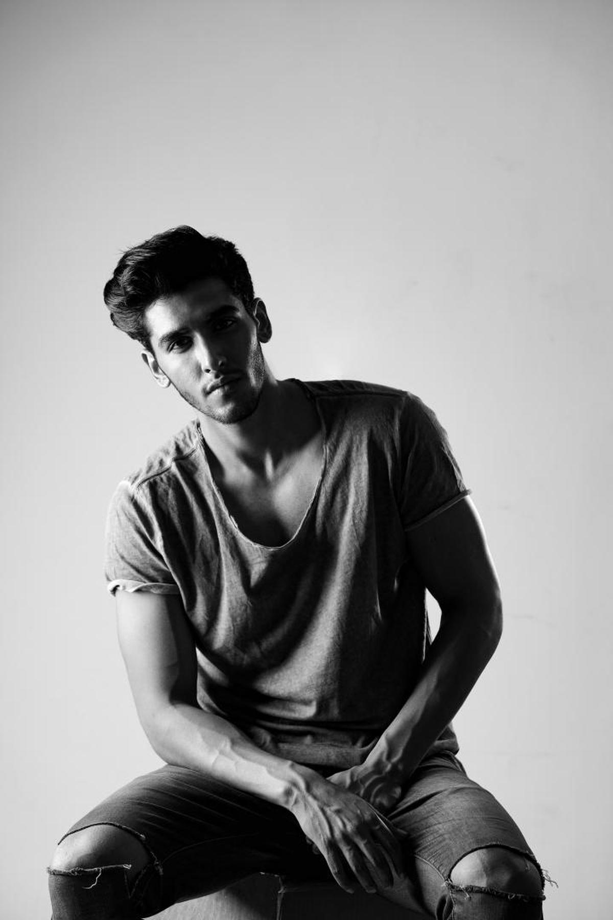 Image of Sitting, Black, Male, Black-and-white, Standing, Photography etc.